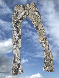 a pair of camouflage pants hanging in the air