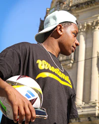 a man holding a soccer ball