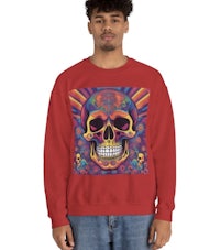 a man wearing a red sweatshirt with a colorful skull on it