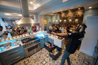 a group of people in a kitchen
