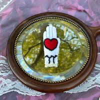 a mirror with a heart on it