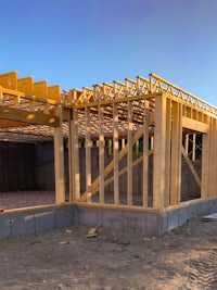 a house under construction with wooden framing