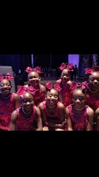 a group of young girls posing for a photo
