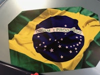 a brazilian flag sits on top of a table