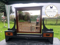 a dressing table with a mirror on it