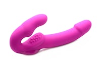 a pink sex toy on a white background
