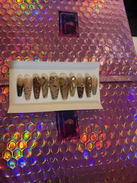 a box of fake nails is sitting on a table