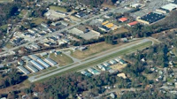 an aerial view of an airport in a town