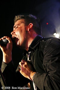 a man singing into a microphone