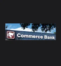 a sign that says commerce bank on a black background