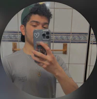 a man is taking a selfie in a bathroom