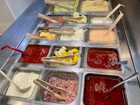 a tray filled with different kinds of sauces and condiments