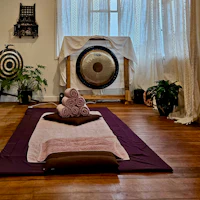 a room with a large gong on the floor