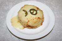 a pizza with jalapenos and cheese on a plate