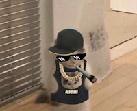 a cat wearing a hat and sunglasses and smoking a cigarette